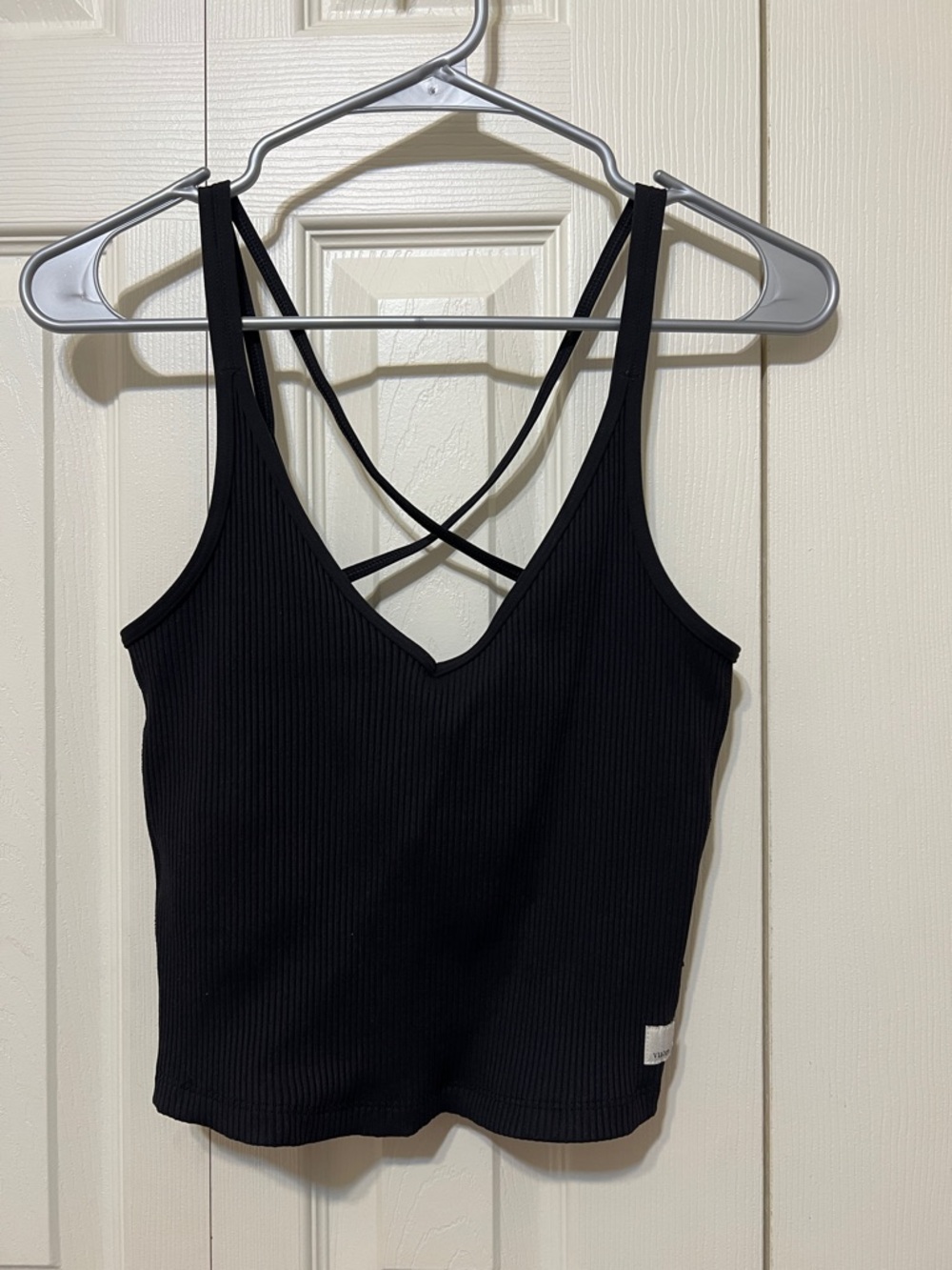 Vuori Black Ribbed V-Neck Tank with Crisscross Back. Built in bra.